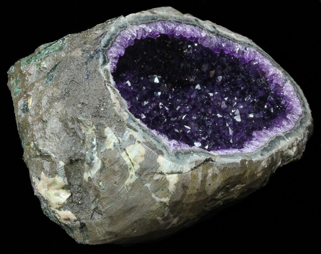 Magnificent amethyst in an agate geode from Uruguay on its wooden base,  Incredible beauty and strength.